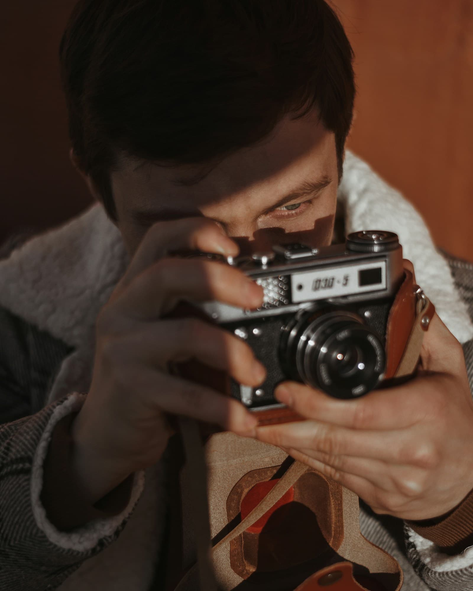 Portrait of a photographer holding a camera